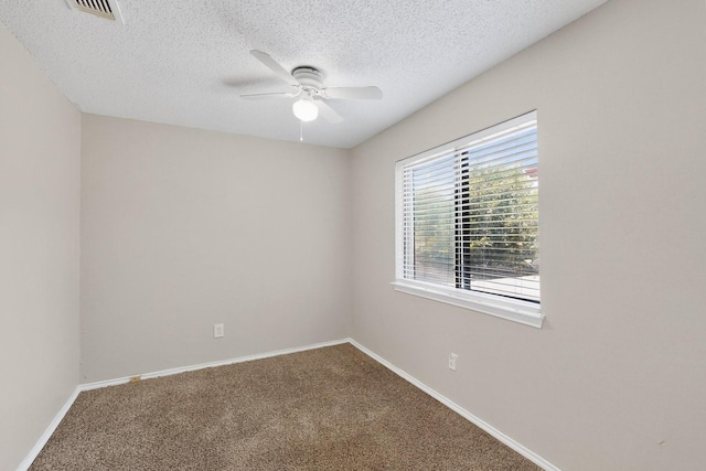 10320 Wood Heights Dr, Dallas, TX 75227 - spare room featuring a ceiling fan, carpet flooring, and a textured ceiling
