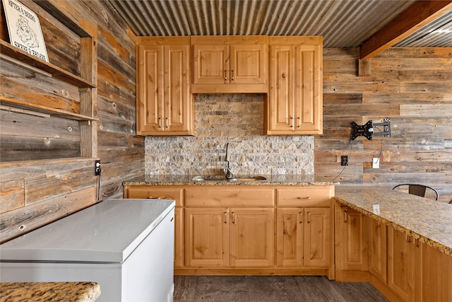 894 W Moonshine Rd, Seymour, TX 76380 - kitchen featuring wood walls, fridge, light stone countertops, tasteful backsplash, and open shelves