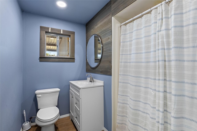 894 W Moonshine Rd, Seymour, TX 76380 - full bathroom with vanity and wood finished floors