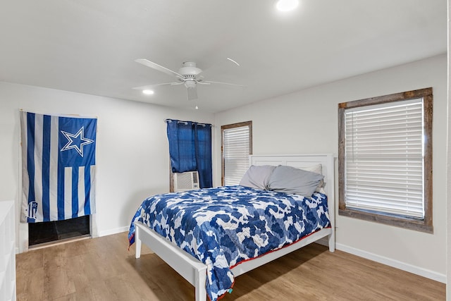 894 W Moonshine Rd, Seymour, TX 76380 - bedroom featuring wood finished floors, a ceiling fan, and recessed lighting