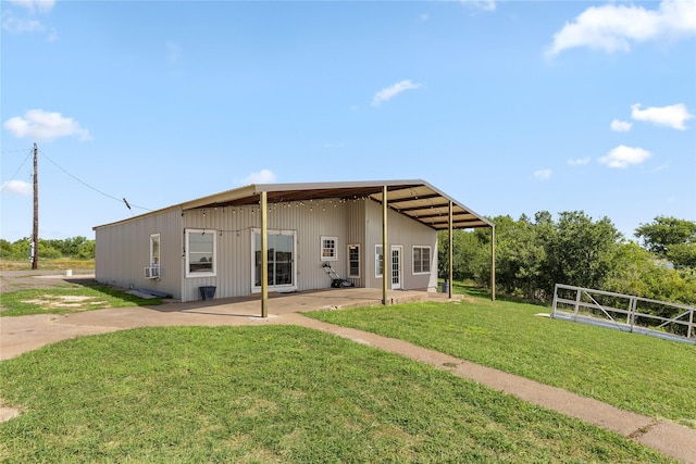 894 W Moonshine Rd, Seymour, TX 76380 - back of house featuring a lawn and a patio