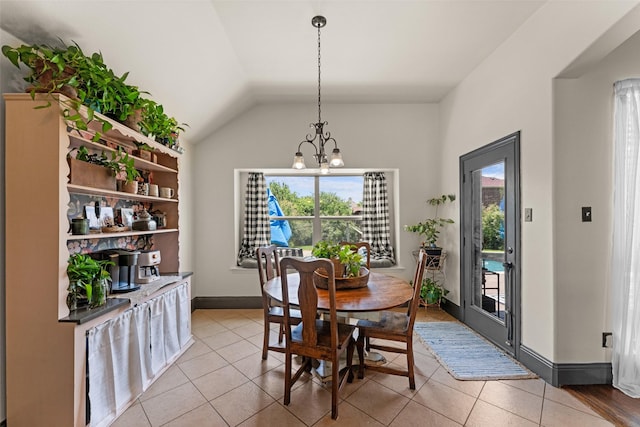 1740 Greenwood Ct, Prosper, TX 75078 - dining area with a chandelier, light tile patterned floors, and vaulted ceiling
