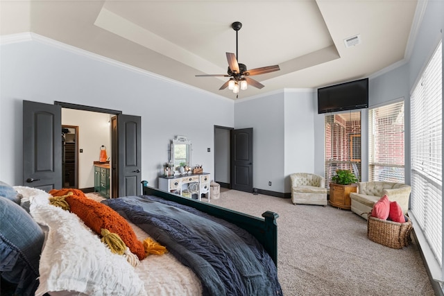 1740 Greenwood Ct, Prosper, TX 75078 - carpeted bedroom featuring multiple windows, a tray ceiling, ornamental molding, and ensuite bath