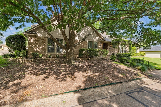 3901 Old Mill Rd, Waco, TX 76710 - view of property hidden behind natural elements featuring brick siding