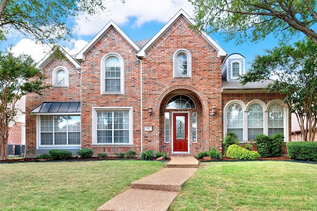 3217 Tearose Dr, Richardson, TX 75082 - view of front facade featuring brick siding, a front lawn, and a shingled roof