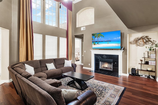3217 Tearose Dr, Richardson, TX 75082 - living area with a towering ceiling, wood finished floors, and a tile fireplace
