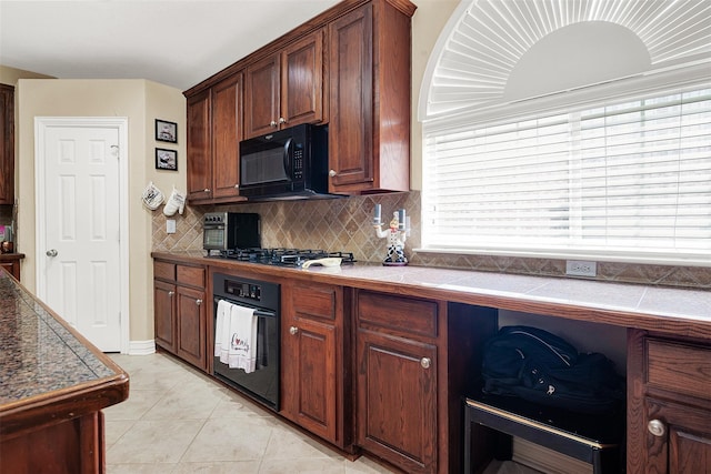 3217 Tearose Dr, Richardson, TX 75082 - kitchen with black appliances, decorative backsplash, light tile patterned floors, and dark countertops