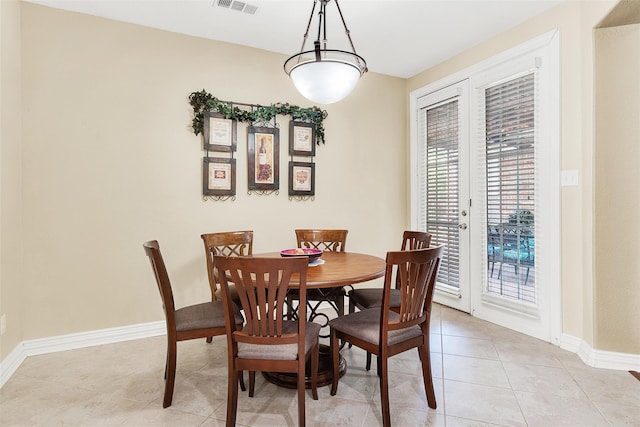 3217 Tearose Dr, Richardson, TX 75082 - dining room featuring light tile patterned floors and baseboards