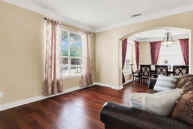 3217 Tearose Dr, Richardson, TX 75082 - living area with arched walkways, wood finished floors, and ornamental molding