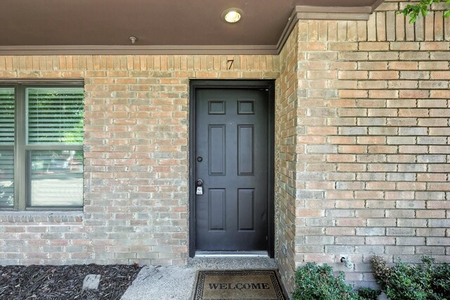 900 W Mulberry St Unit 7, Denton, TX 76201 - view of exterior entry featuring brick siding