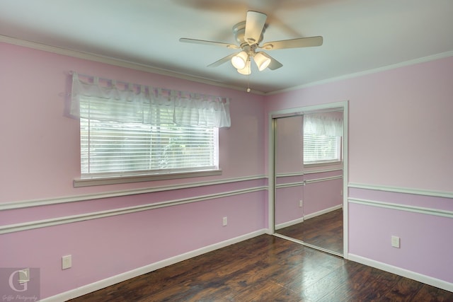 613 Pine Cone Dr, Haughton, LA 71037 - unfurnished bedroom with multiple windows, a closet, wood finished floors, crown molding, and ceiling fan