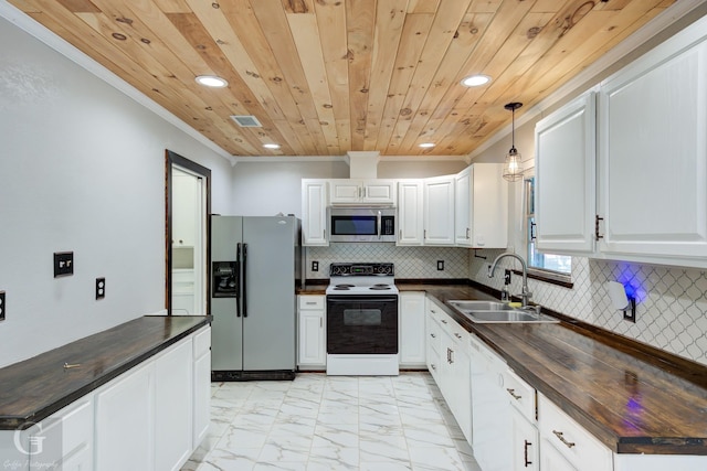613 Pine Cone Dr, Haughton, LA 71037 - kitchen featuring fridge with ice dispenser, white electric range, stainless steel microwave, recessed lighting, and crown molding