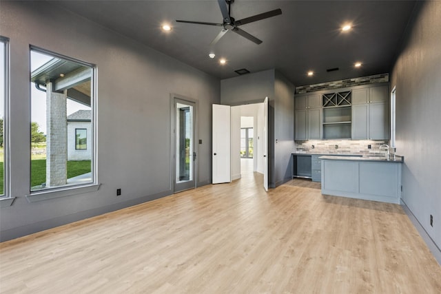 4930 Magnolia Trl, Midlothian, TX 76065 - unfurnished living room featuring light wood-style flooring, ceiling fan, and recessed lighting
