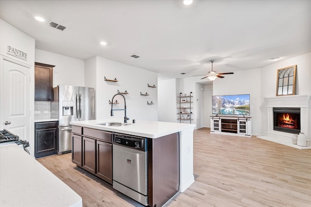 813 Evergreen St, Princeton, TX 75407 - kitchen with appliances with stainless steel finishes, light countertops, open floor plan, a ceiling fan, and a kitchen island with sink