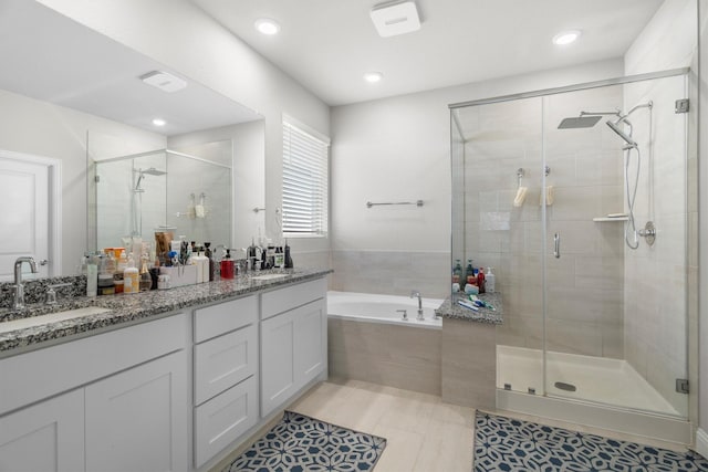 332 Augusta Ct, Oak Point, TX 75068 - full bath with a shower stall, double vanity, a garden tub, tile patterned floors, and recessed lighting