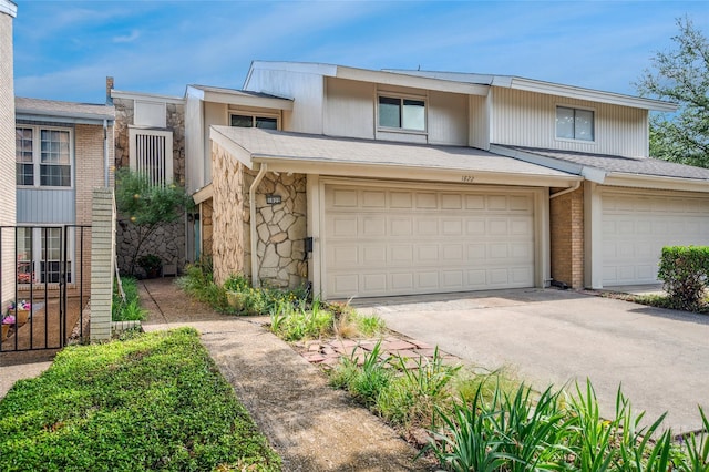 1822 Lakecrest Ct, Carrollton, TX 75006 - view of property with stone siding, concrete driveway, and an attached garage