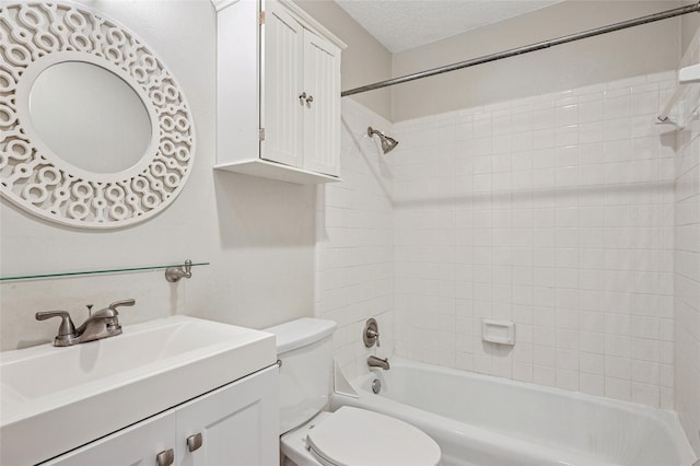 1822 Lakecrest Ct, Carrollton, TX 75006 - bathroom featuring vanity, washtub / shower combination, and a textured ceiling