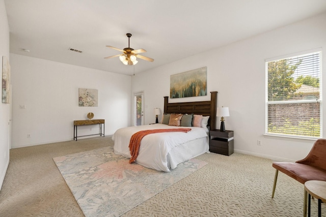 1205 Apache Lake Dr, Carrollton, TX 75010 - bedroom featuring carpet floors, multiple windows, and a ceiling fan
