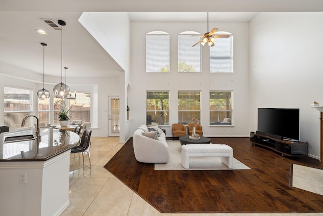 1205 Apache Lake Dr, Carrollton, TX 75010 - living area featuring ceiling fan, healthy amount of natural light, a high ceiling, and recessed lighting
