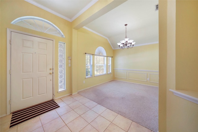 8201 Fountain Ridge Dr, Plano, TX 75025 - entrance foyer featuring a chandelier, ornamental molding, light carpet, a wainscoted wall, and lofted ceiling