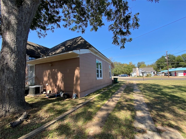 416 W Palestine Ave, Palestine, TX 75801 - view of side of property with a central AC unit and a lawn
