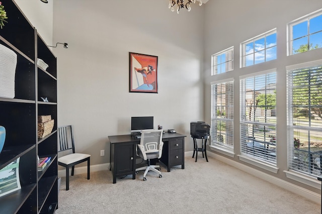 13004 Stapleton Dr, Frisco, TX 75033 - office space featuring carpet flooring, a towering ceiling, and a chandelier