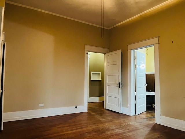 106 Lawrence Ave, Terrell, TX 75160 - unfurnished room featuring ornamental molding and wood finished floors
