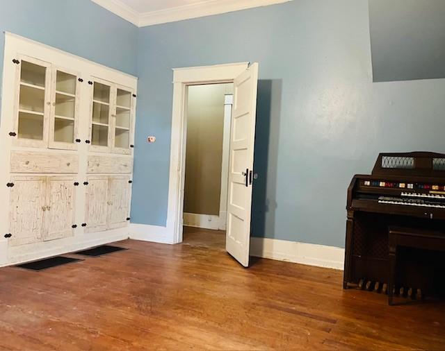 106 Lawrence Ave, Terrell, TX 75160 - dining room featuring crown molding and wood finished floors