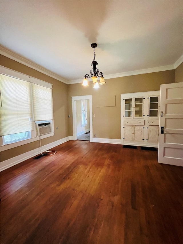 106 Lawrence Ave, Terrell, TX 75160 - unfurnished dining area featuring a chandelier, cooling unit, dark wood-type flooring, and crown molding