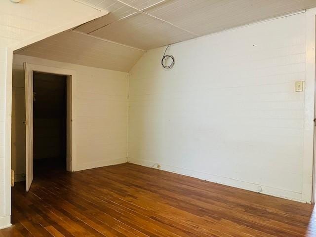 106 Lawrence Ave, Terrell, TX 75160 - spare room featuring wood-type flooring and vaulted ceiling