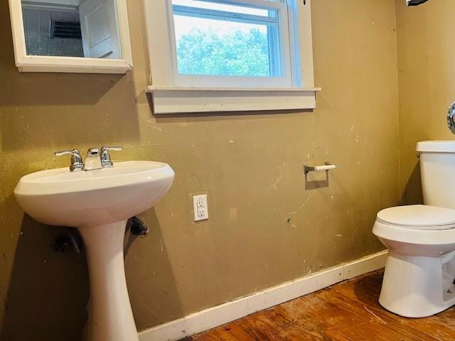 106 Lawrence Ave, Terrell, TX 75160 - bathroom featuring toilet and wood finished floors
