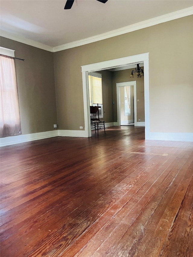 106 Lawrence Ave, Terrell, TX 75160 - spare room with hardwood / wood-style flooring, ornamental molding, a ceiling fan, and a chandelier