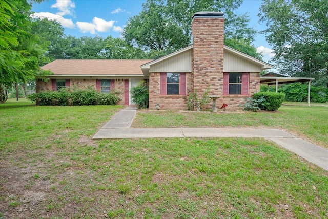 6179 State Highway 31 E, Murchison, TX 75778 - view of front of home featuring a chimney, a front yard, and brick siding