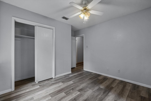 6179 State Highway 31 E, Murchison, TX 75778 - unfurnished bedroom featuring wood finished floors, a closet, and a ceiling fan