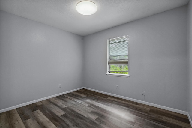 6179 State Highway 31 E, Murchison, TX 75778 - unfurnished room with dark wood-style flooring and baseboards