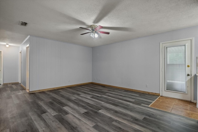 6179 State Highway 31 E, Murchison, TX 75778 - unfurnished room with ceiling fan, wood finished floors, and a textured ceiling