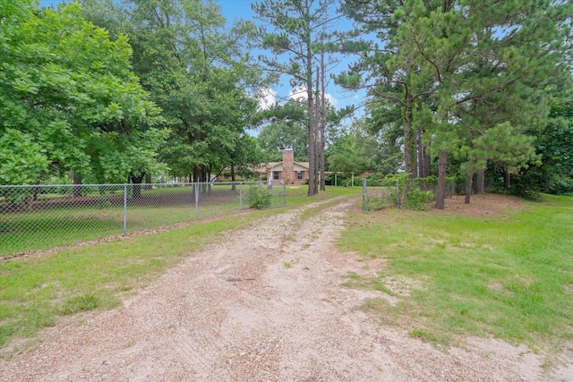 6179 State Highway 31 E, Murchison, TX 75778 - view of dirt / gravel driveway with a gated entry