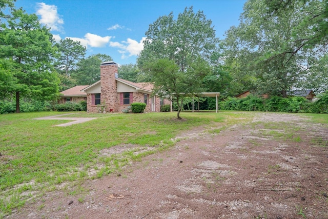6179 State Highway 31 E, Murchison, TX 75778 - back of property featuring a chimney, a yard, and brick siding