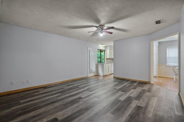 6179 State Highway 31 E, Murchison, TX 75778 - empty room with ceiling fan, wood finished floors, and a textured ceiling