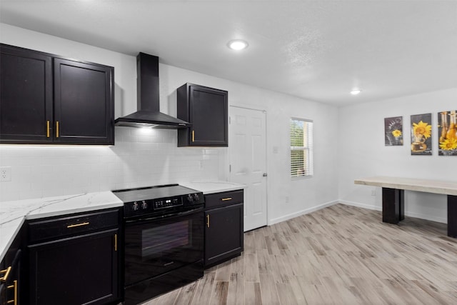 1035 Warden St, Benbrook, TX 76126 - kitchen featuring wall chimney range hood, black electric range, backsplash, light wood-type flooring, and recessed lighting