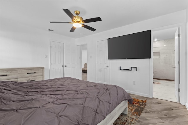 1035 Warden St, Benbrook, TX 76126 - bedroom featuring a ceiling fan, wood finished floors, and ensuite bath