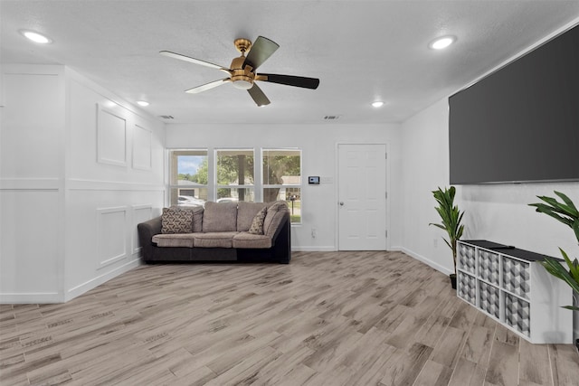 1035 Warden St, Benbrook, TX 76126 - living area featuring a ceiling fan, light wood-style flooring, and recessed lighting