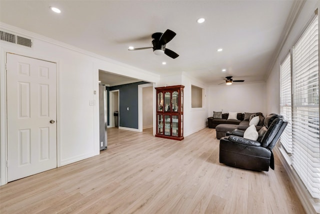 1406 Highland St, Mesquite, TX 75149 - living room featuring ceiling fan, light wood-style floors, ornamental molding, and recessed lighting