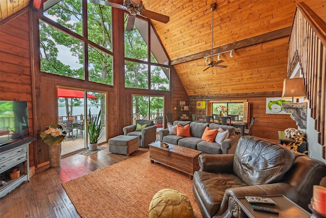 329 Hickory Hill Ln, Scroggins, TX 75480 - living area with a ceiling fan, high vaulted ceiling, wooden walls, hardwood / wood-style floors, and a wood ceiling with exposed beams