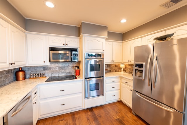 329 Hickory Hill Ln, Scroggins, TX 75480 - kitchen with appliances with stainless steel finishes, backsplash, white cabinetry, recessed lighting, and light stone counters