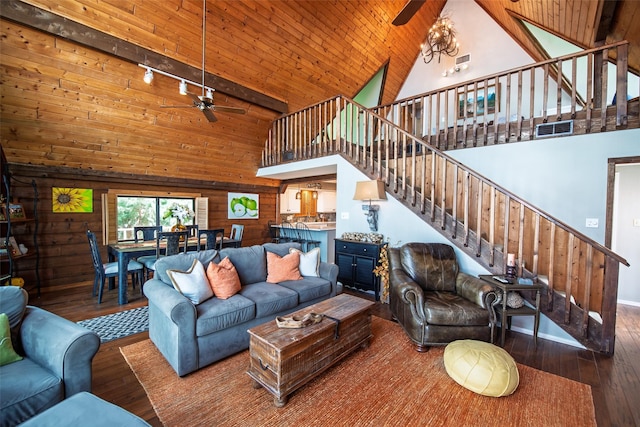 329 Hickory Hill Ln, Scroggins, TX 75480 - living area with a ceiling fan, high vaulted ceiling, wooden walls, hardwood / wood-style flooring, and stairway