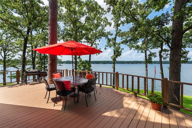 329 Hickory Hill Ln, Scroggins, TX 75480 - wooden terrace with outdoor dining area, a water view, and grilling area