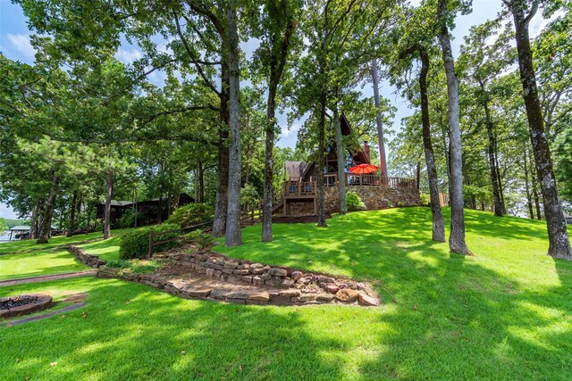 329 Hickory Hill Ln, Scroggins, TX 75480 - view of grassy yard featuring a wooden deck and stairway