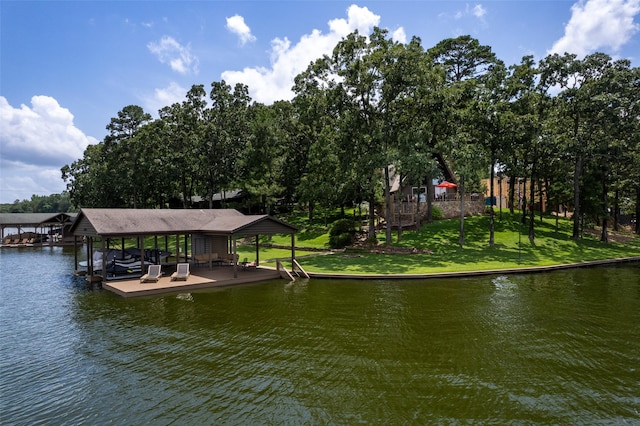 329 Hickory Hill Ln, Scroggins, TX 75480 - dock with boat lift, a water view, and view of wooded area