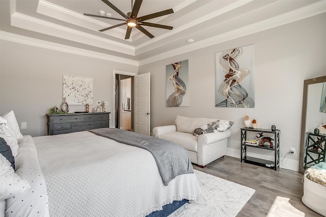 720 Glade Park Ct, Azle, TX 76020 - bedroom featuring a tray ceiling, crown molding, wood finished floors, and ceiling fan